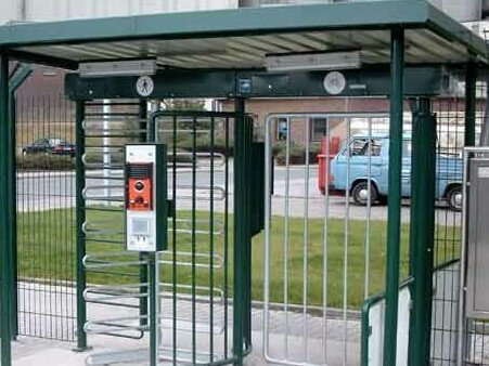 Full height external turnstiles with canopy